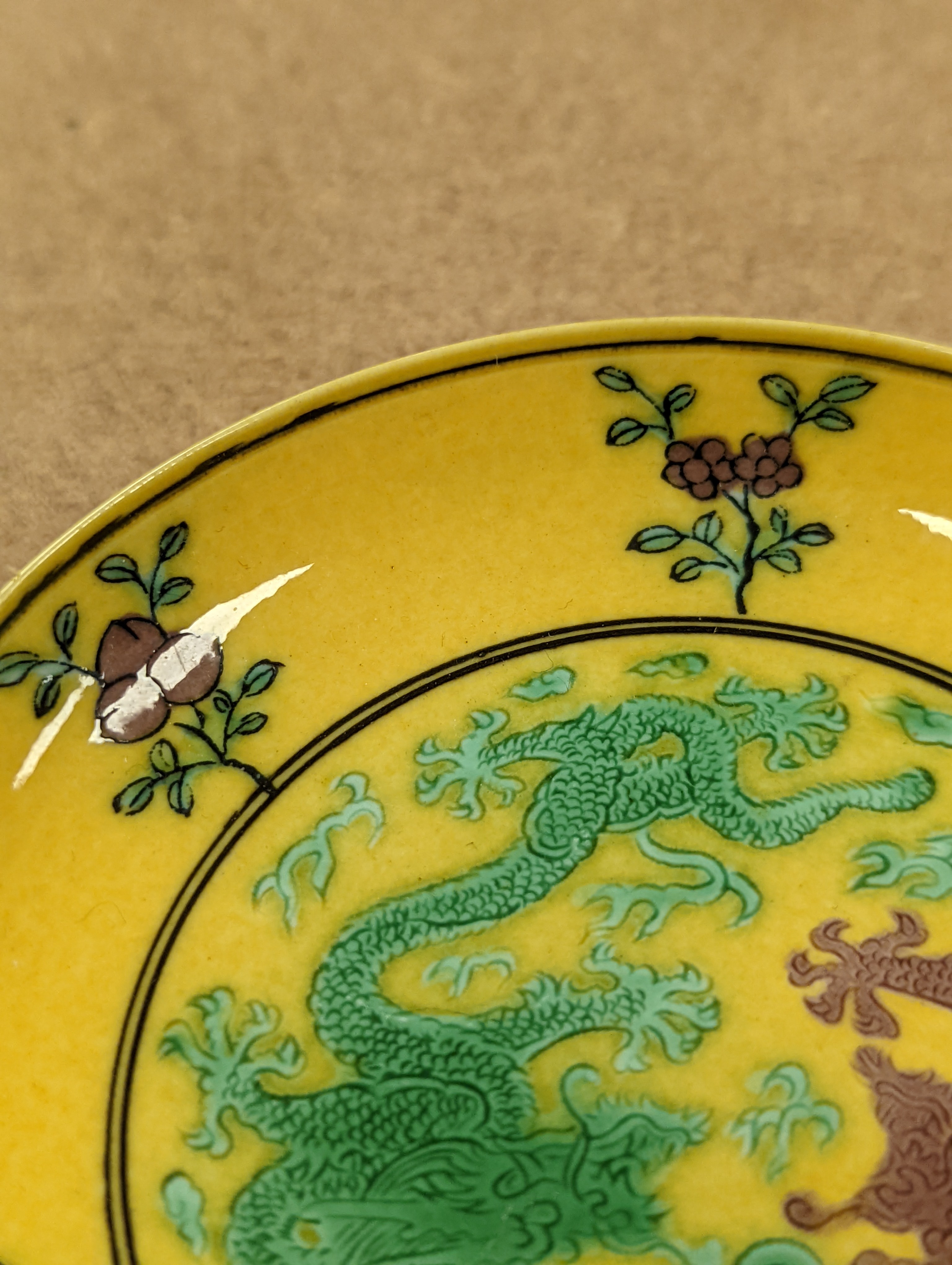 A Chinese yellow ground green and aubergine enamelled 'dragon' dish, Guangxu mark and possibly of the period, D.11cm